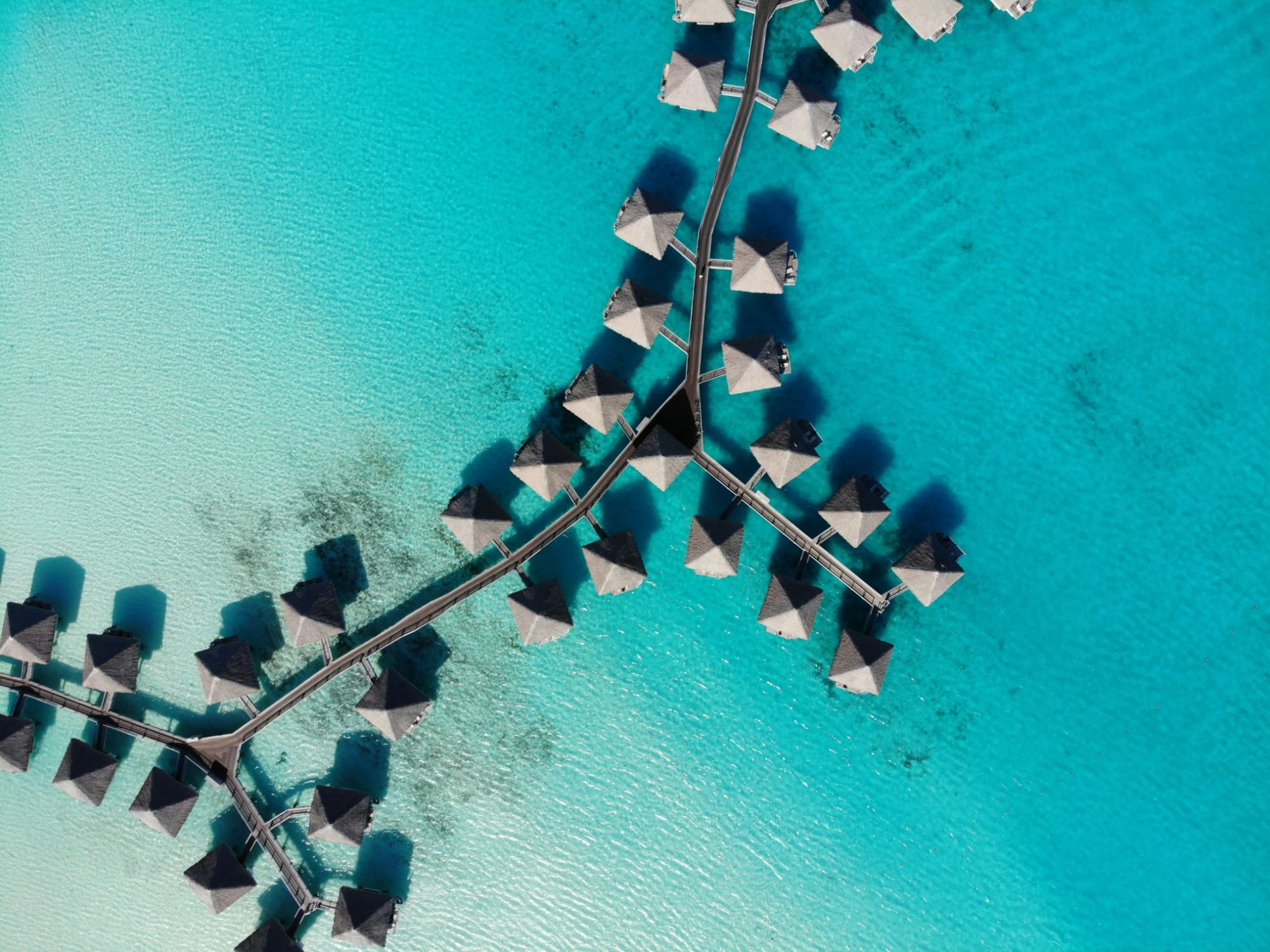 Aerial view of overwater bungalows in Bora Bora